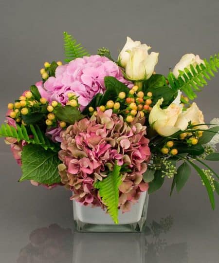 A classic collection of ever popular hydrangea from Holland and beautiful roses accented with seasonal foliage is appropriate for any occasion. Subtle and lush. Colors will vary based on availability, overall look and feel remains constant.