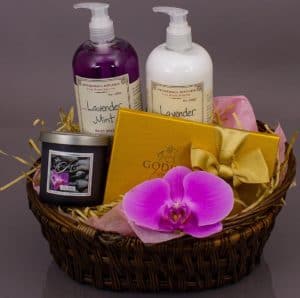 Our handmade spa baskets are a great choice for many occasions that call for a relaxing treat. We've combined 2 generous bottles of beautifully scented soap and lotion with a scented candle made in Massachusetts......oh, and a box of luxurious Godiva chocolates accented with an exquisite phalaenopsis orchid blossom.